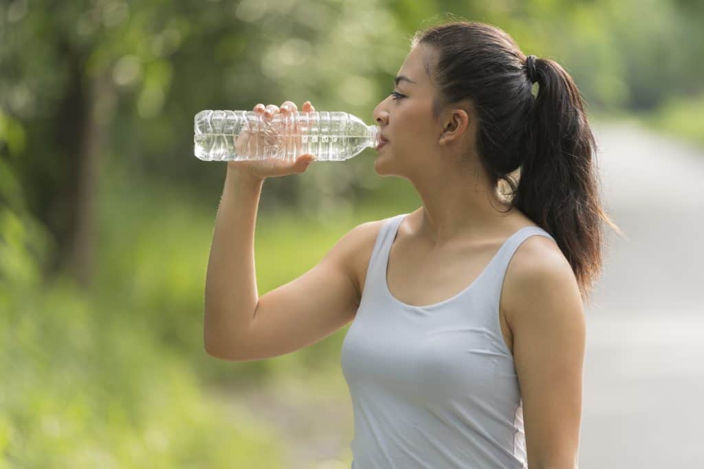 woman-drinking-after-hard-workout