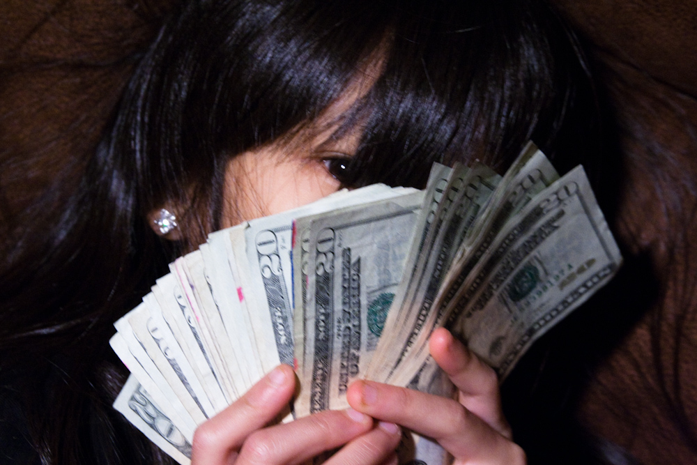 Woman with lots of money