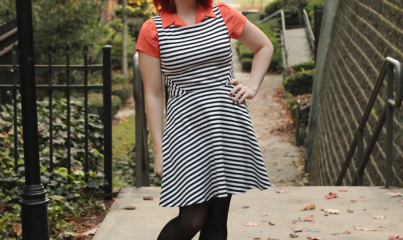black_and_white_striped_dress_over_an_orange_shirt_with_black_cutout_boots_22613417316-1