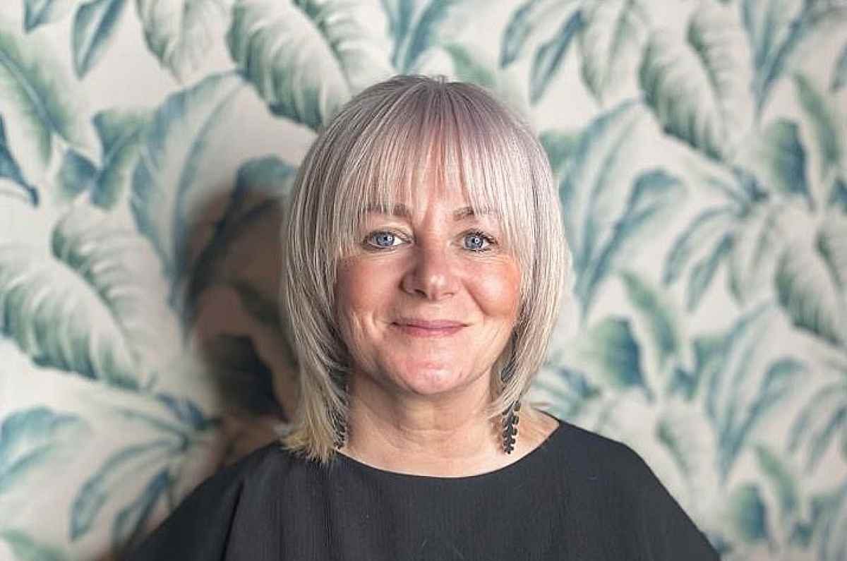 ash-blonde-lob-with-face-framing-layers-and-bangs-for-women-over-fifty