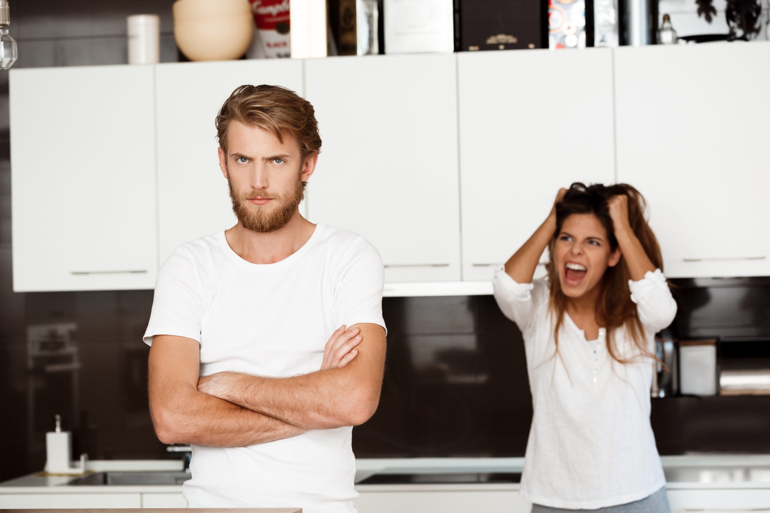 displeased-handsome-man-in-quarrel-with-his-girlfriend-background