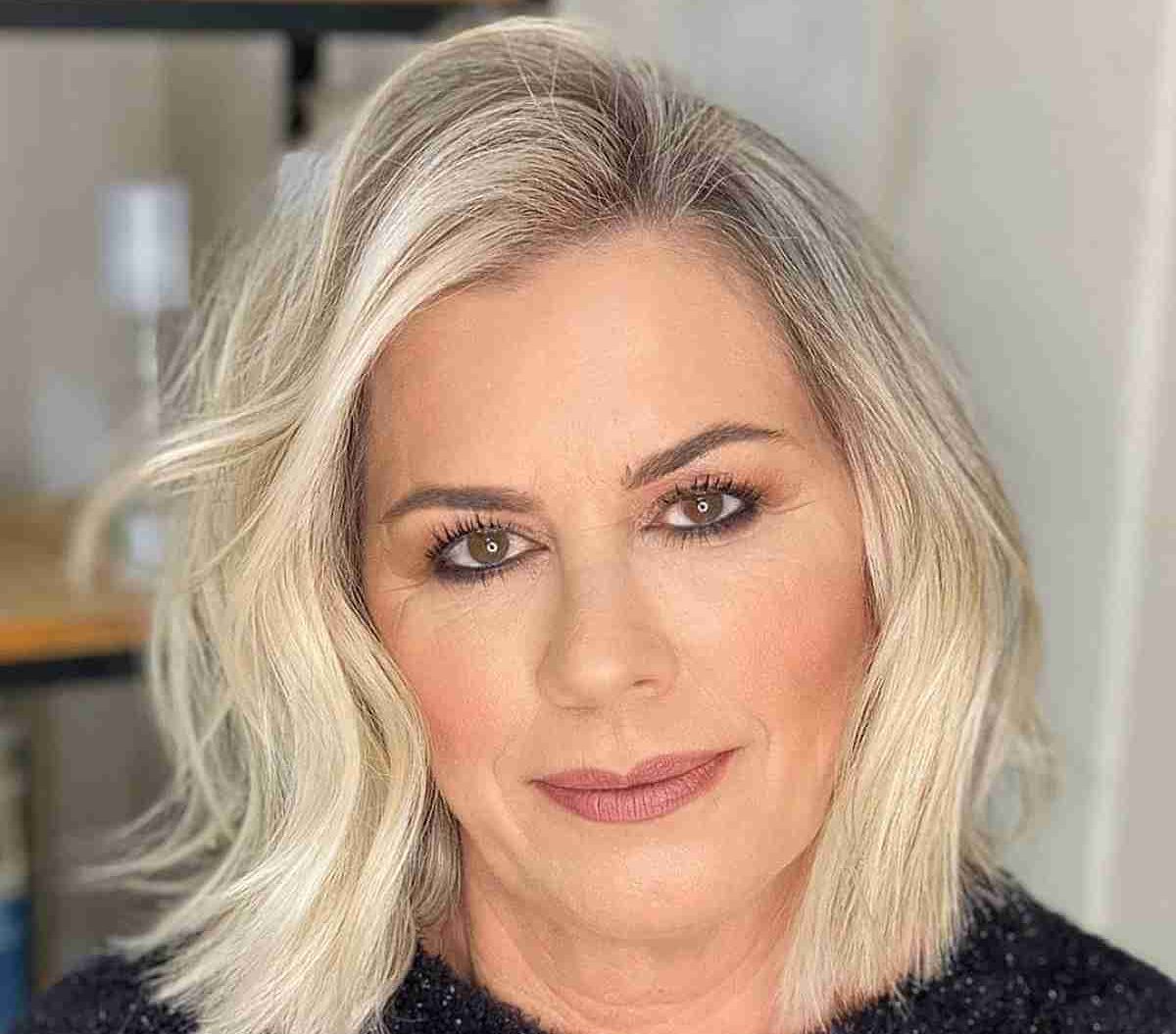 short-to-medium-haircut-with-a-deep-side-part-for-ladies-over-fifty