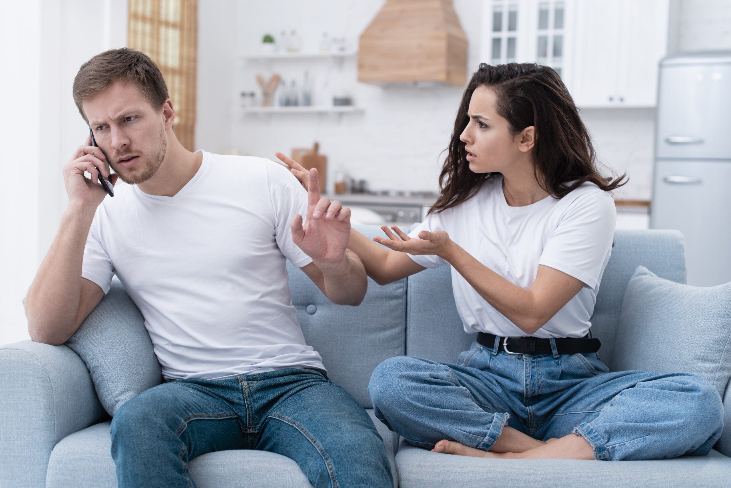 woman-being-angry-while-her-boyfriend-is-talking-phone