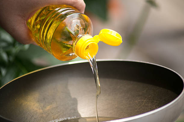pouring-food-oil-in-hot-pan-for-deep-frying