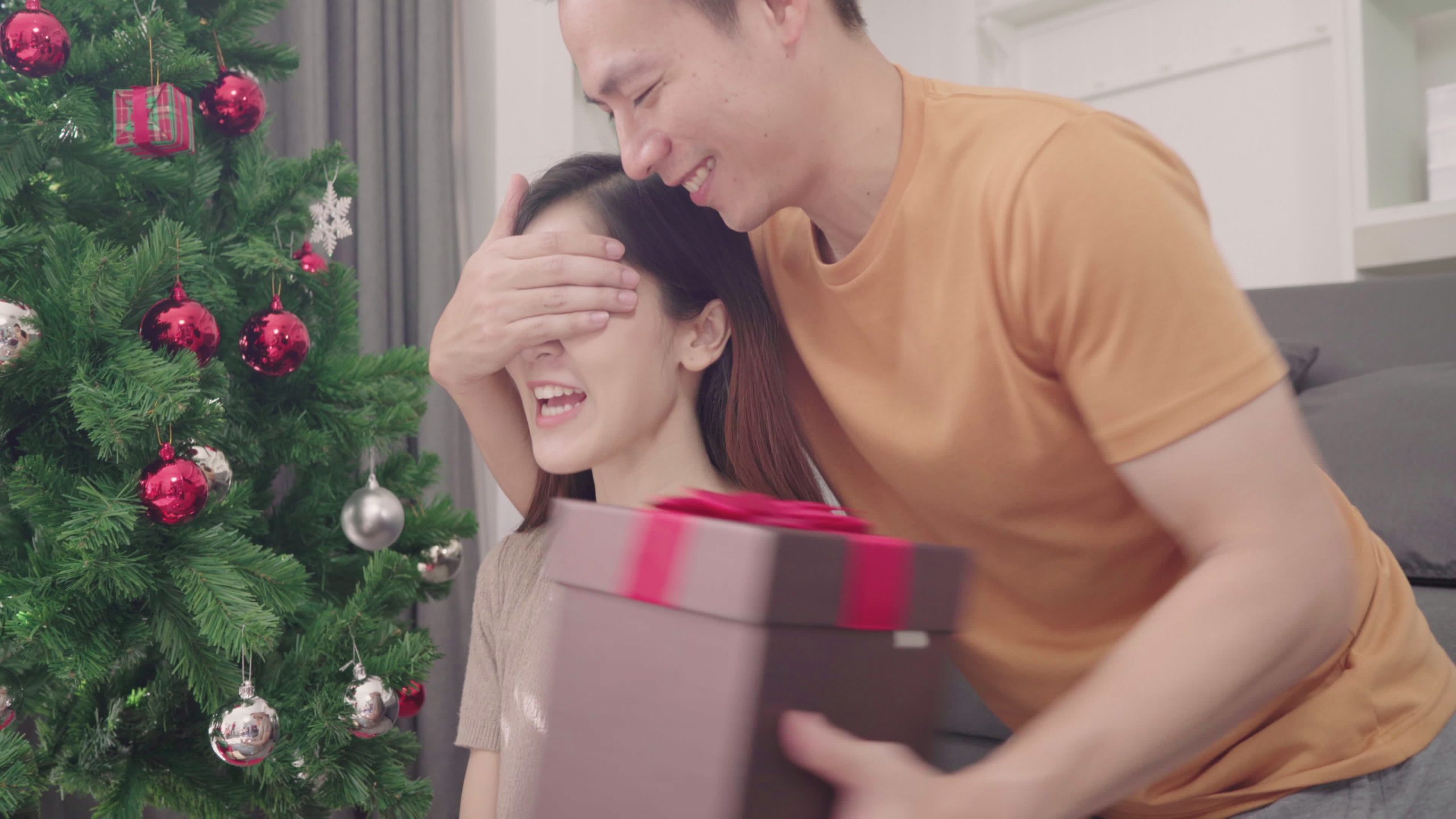 asian-couple-exchanging-christmas-gifts-free-video