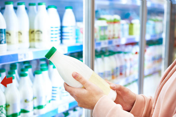 woman-shopping-milk-in-grocery-store