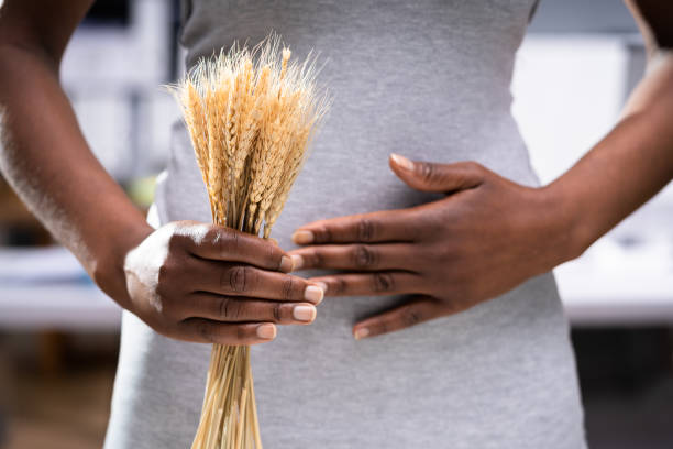 celiac-disease-and-gluten-intolerance-women-holding-spikelet-of-wheat
