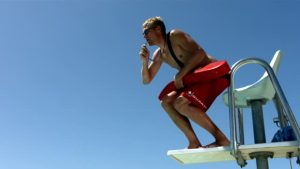 hd-1080p-lifeguard-jumps-into-pool-slow-motion