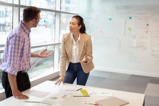 multiracial-work-colleagues-having-meeting-in-modern-business-office