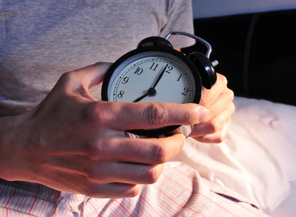 close-up-man-setting-alarm