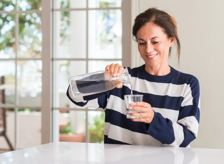 mature-woman-pouring-water