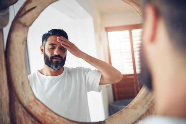 shot-of-a-mature-man-standing-in-front-of-the-bathroom-mirror-looking-exhausted
