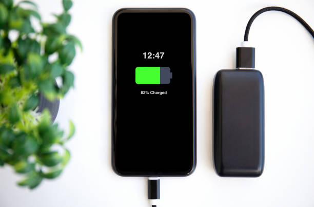 phone-with-charged-battery-on-the-screen-connected-to-powerbank-charge