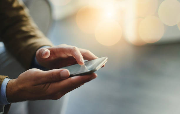 high-angle-shot-of-an-unrecognizable-businessman-using-a-mobile-phone