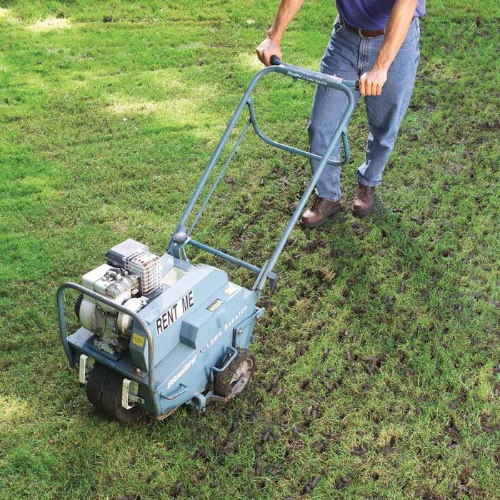 man-walks-behind-lawn-aerator-fh03sep_03066_016