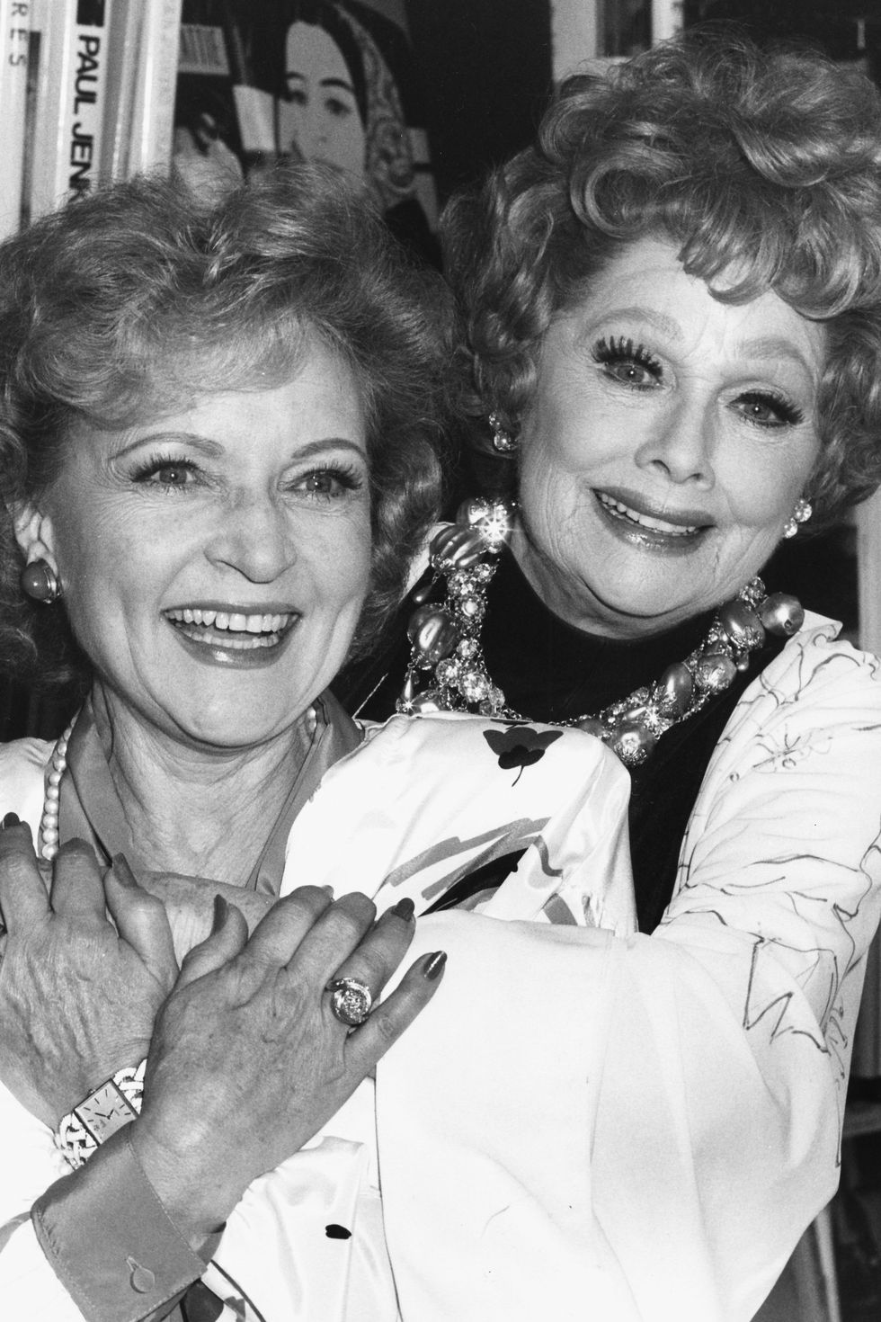 actresses-betty-white-and-lucille-ball-embracing-at-a-book-news-photo-1578777047