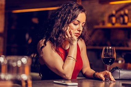 woman-with-natural-makeup-feeling-bad-sitting-alone