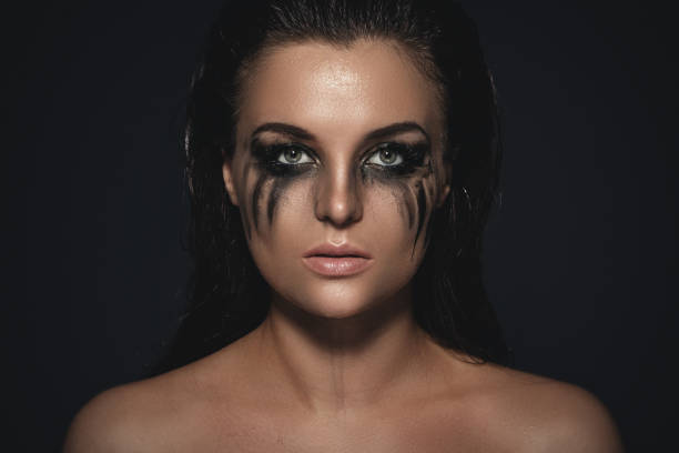 portrait-of-sad-and-beautiful-woman-with-smudged-makeup-on-her-face