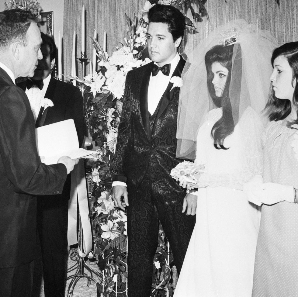 elvis-presley-and-his-bride-the-former-priscilla-ann-beaulieu-are-pronounced-man-and-wife-by-nevada-supreme-court-justice-david-zenoff-at-the-aladdin-hotel-getty