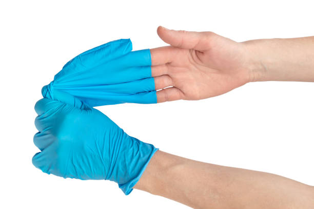 nurse-removing-gloves-from-her-hand-close-up-isolated-on-white