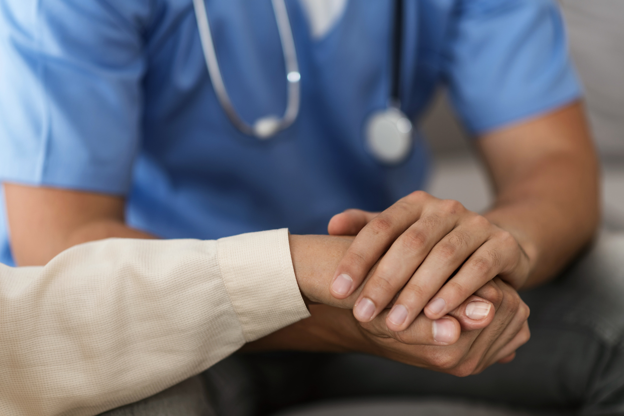 medicine-doctor-hand-reassuring-her-female-patient-closeup