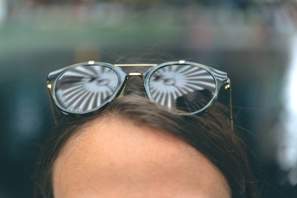 close-up-on-a-young-woman-forehead-wearing-sunglasses