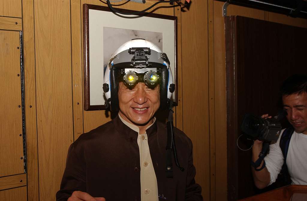 jackie-chan-tries-on-a-fighter-pilotreplacement-characters-helmet-with-night-629722-1024