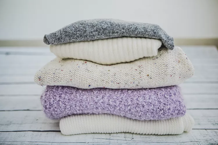 variety-of-sweaters-piled-up-882913010-5aa40250119fa800370c5175