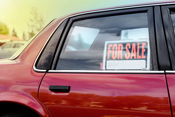 shiny-car-for-sale-in-summer-weather-parked-with-a-red-vibrant-color-exterior