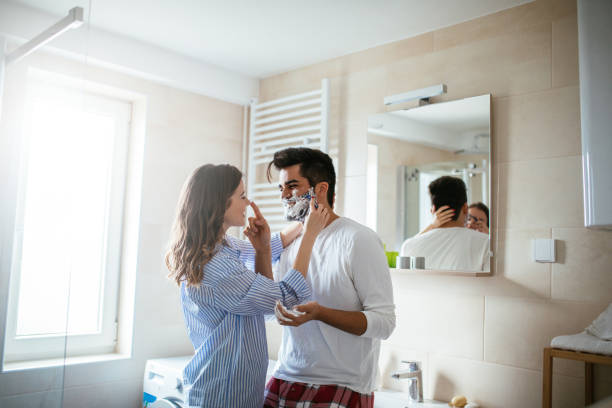 portrait-of-young-happy-couple-getting-ready-together-in-the-bathroom