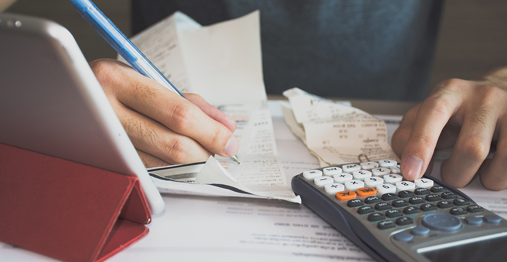 man-using-calculator-for-calculate-expenses-accounts