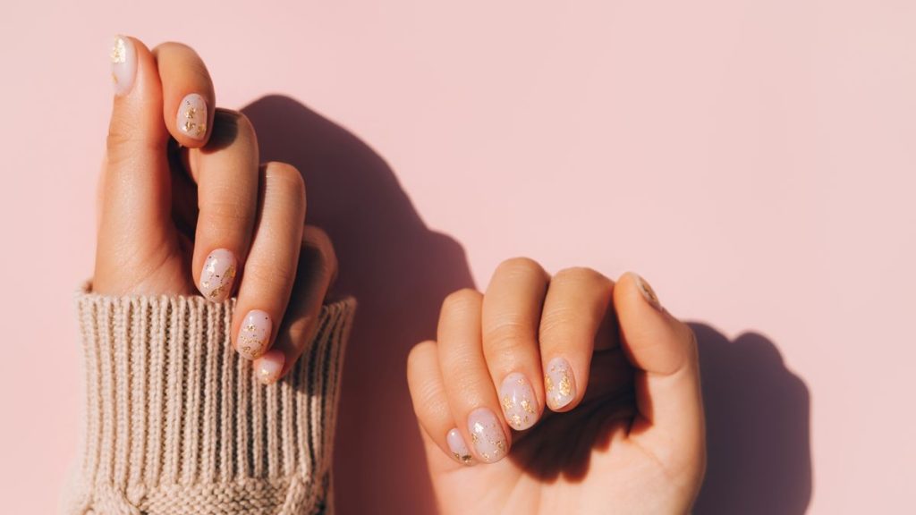 glowing-hands-in-sweater-with-knitted-sleeves-and-royalty-free-image-1644003632