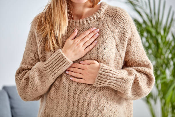 young-woman-with-heart-problem-holding-chest