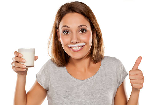 happy-young-beautiful-woman-with-a-yogurt-mustache-showing-thumbs-up