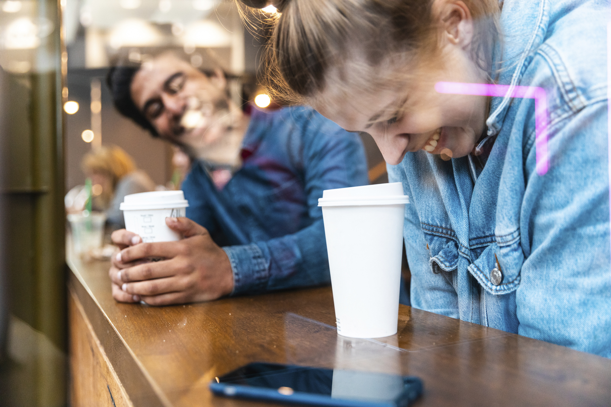 friends-having-fun-together-in-a-coffee-shop